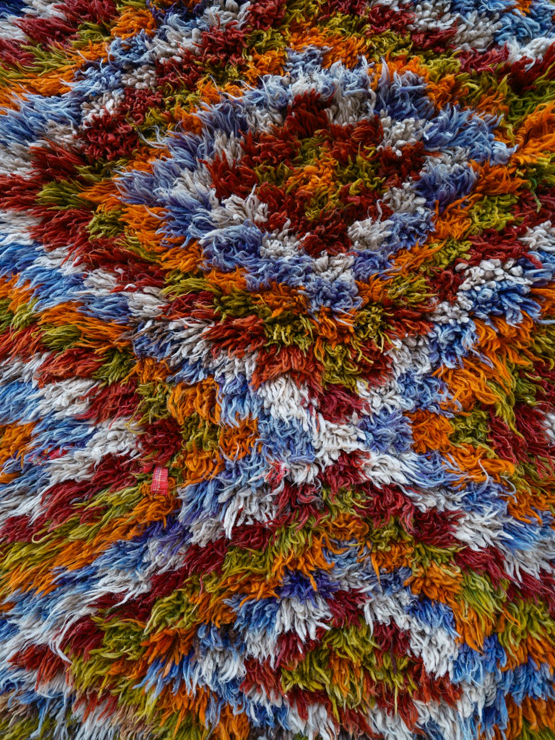 Multicolored handmade rug with a circular design